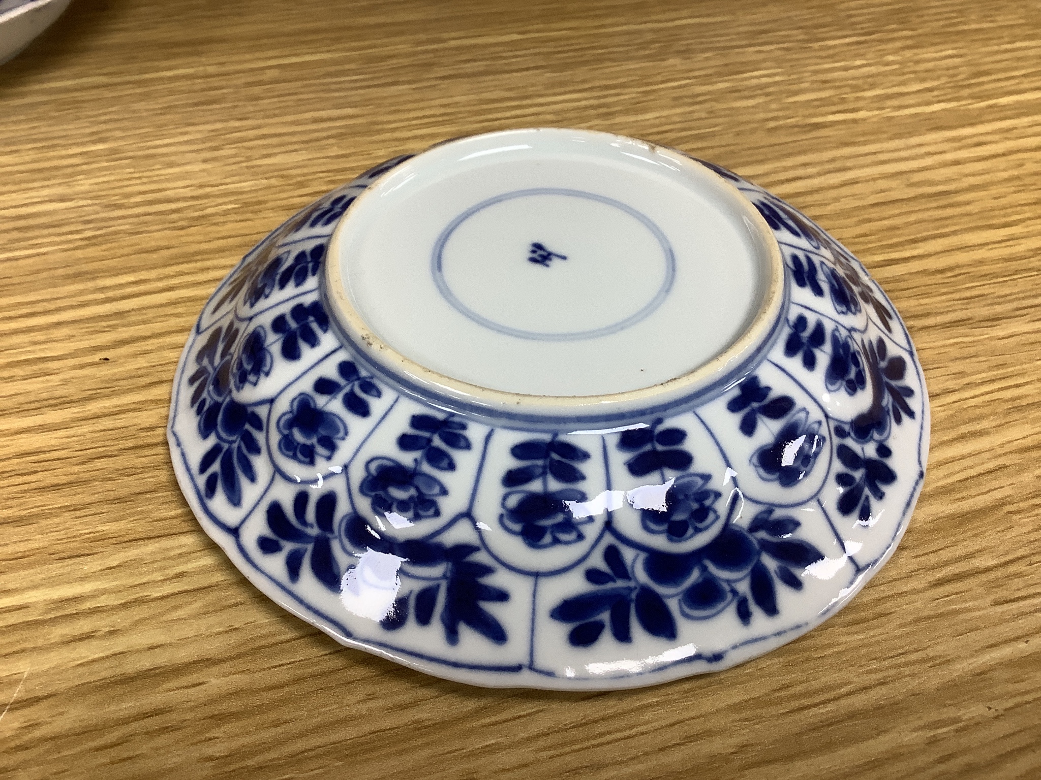 A Chinese blue and white plate 13cm diameter, a similar tea bowl and saucer, Kangxi period and a 19th century Chinese blue and white bottle vase